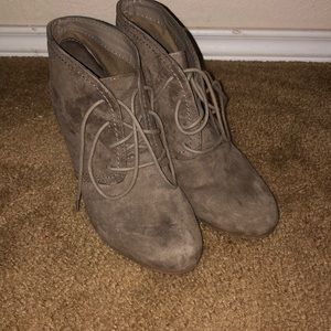 Lace up suede booties with a heel